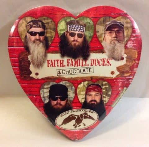 <p>Nothing says <em>I love you</em> like a <a rel="nofollow noopener" href="http://www.ebay.com/itm/A-E-Duck-Dynasty-ELMER-Chocolate-Valentines-Day-Heart-Candy-Gift-Box-New-USA-/272521948004?hash=item3f7392eb64:g:T-YAAOSw5cNYelrv" target="_blank" data-ylk="slk:box of chocolates;elm:context_link;itc:0;sec:content-canvas" class="link ">box of chocolates</a> plastered with the hairy faces of five men who whittle duck-calling tools out of wood.</p>