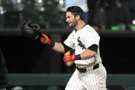 Chicago White Sox's Andrew Benintendi begins to celebrate after his winning two-run home run off Tampa Bay Rays relief pitcher Phil Maton to end a 10-inning baseball game Saturday, April 27, 2024, in Chicago. (AP Photo/Charles Rex Arbogast)