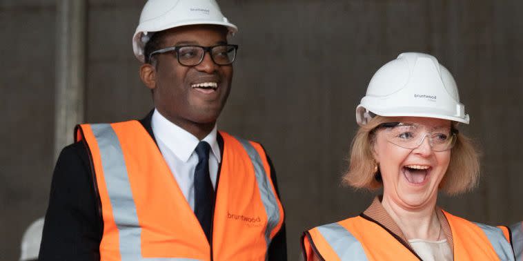 birmingham, england   october 04 prime minister liz truss and chancellor of the exchequer kwasi kwarteng left during a visit to a construction site for a medical innovation campus in birmingham, on day three of the conservative party annual conference at the international convention centre in birmingham on october 04, 2022 in birmingham, england this year the conservative party conference will be looking at getting britain moving with more jobs and higher salaries however, delegates are arriving at the conference as the party lags 33 points behind labour in the opinion polls photo by stefan rousseau   wpa poolgetty images