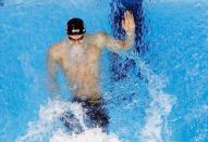 2016 Rio Olympics - Swimming - Final - Men's 100m Backstroke Final - Olympic Aquatics Stadium - Rio de Janeiro, Brazil - 08/08/2016. Ryan Murphy (USA) of USA celebrates. Picture rotated 180 degrees. REUTERS/Athit Perawongmetha