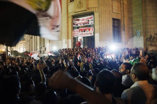 Thousands of supporters of Egyptian President Mohammed Morsi celebrate in front of the Egyptian High Court in Cairo. Morsi assumed sweeping powers on Thursday, drawing criticism he was seeking to be a "new pharoah" and raising questions about the gains of last year's uprising to oust Hosni Mubarak