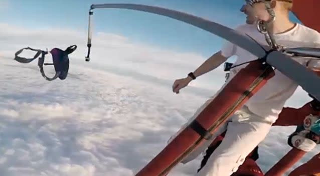 Antti Pendikainen throws the parachute out of the balloon. Photo: YouTube