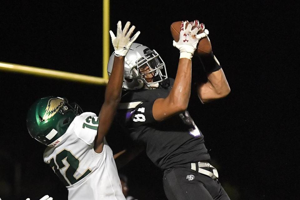 South Garner’s Najai Hines (9) makes the catch for the touchdown against Enloe’s Desmond Massey (12) in the second half. The Enloe Eagles and the South Garner Titans met in a non-conference game in Wake Forest, N.C. on September 8, 2023.
