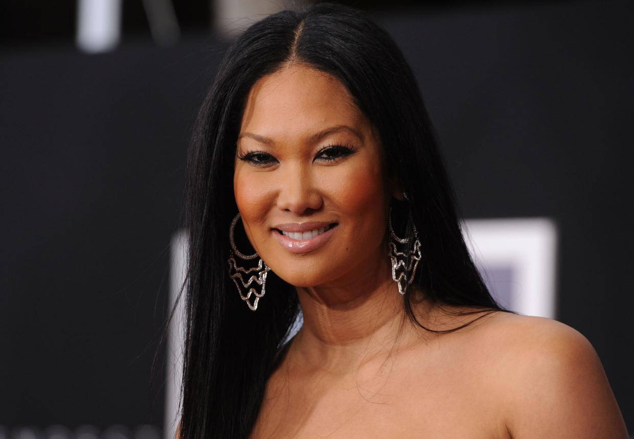 Kimora Lee Simmons arrives at the premiere of Touchstone Pictures and Miramax Films' 'The Tempest' at the El Capitan Theatre on December 6, 2010 in Los Angeles, California. (Photo by Frazer Harrison/Getty Images)