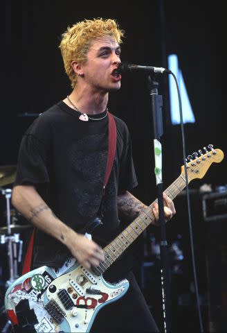 <p>Tim Mosenfelder/Getty</p> Billie Joe Armstrong performing in 1994