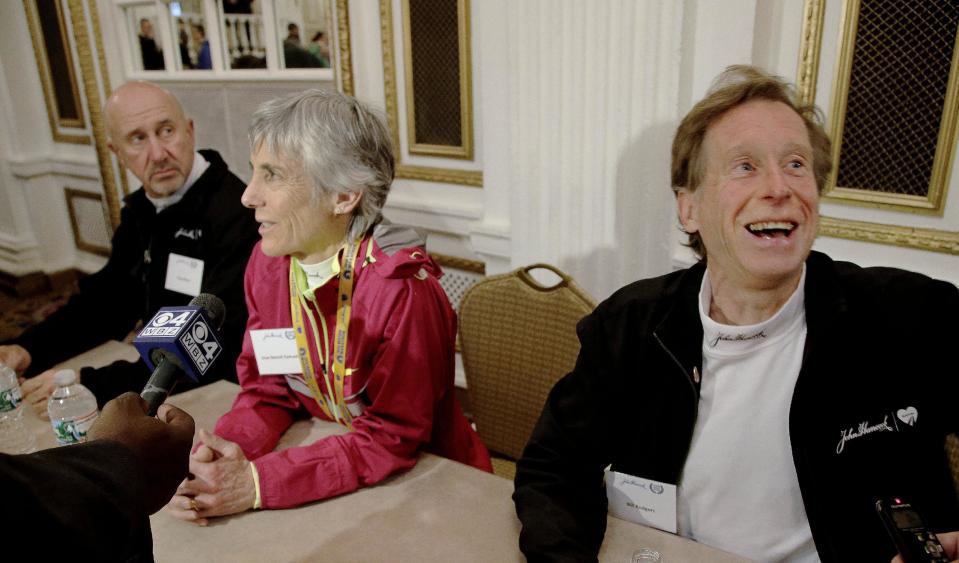 Former Boston Marathon winners, right to left, Bill Rogers, Joan Benoit Samuelson and Greg Meyer conduct interviews with reporters during a media availability at the Copley Plaza Hotel in Boston Friday April 18, 2014. The 118th running of the Boston Marathon is Monday April 21, 2014. (AP Photo/Stephan Savoia)