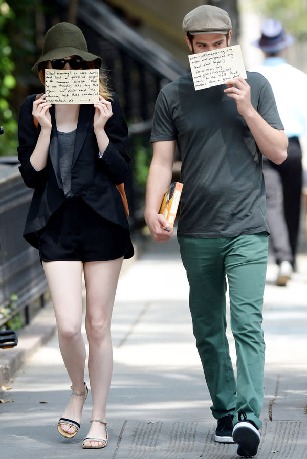 Emma Stone and Andrew Garfield fool paparazzi with charity notes