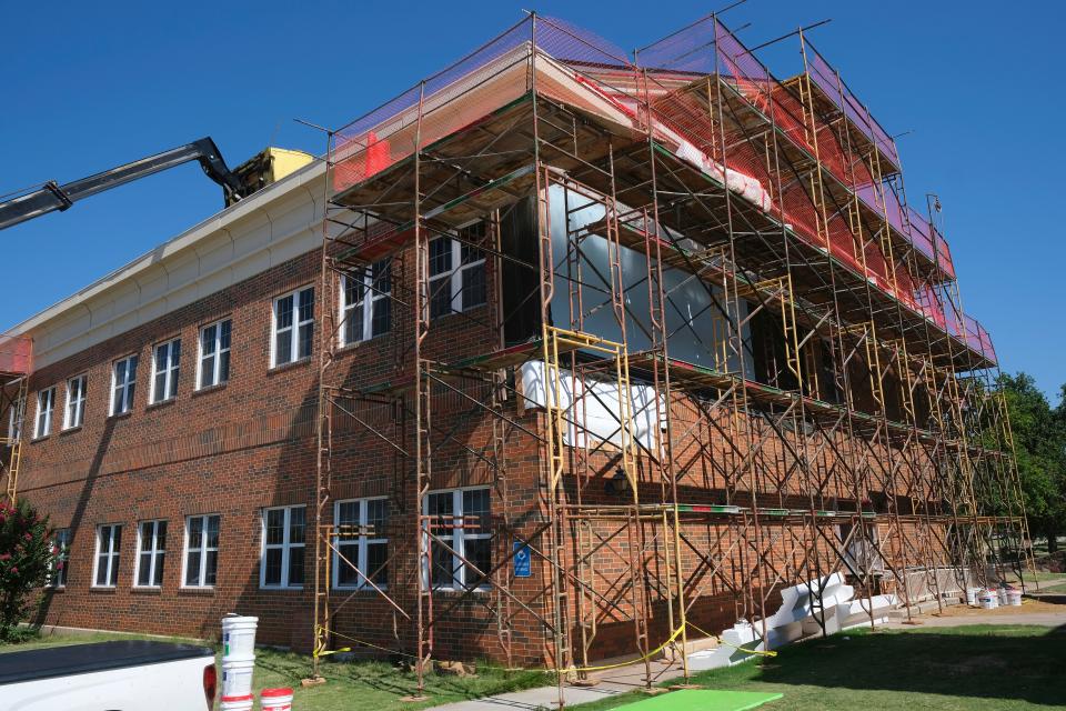 Work continues on the Bailey Business Center building, which sustained major damage during an April tornado that went through the middle of the Oklahoma Baptist University campus in Shawnee.