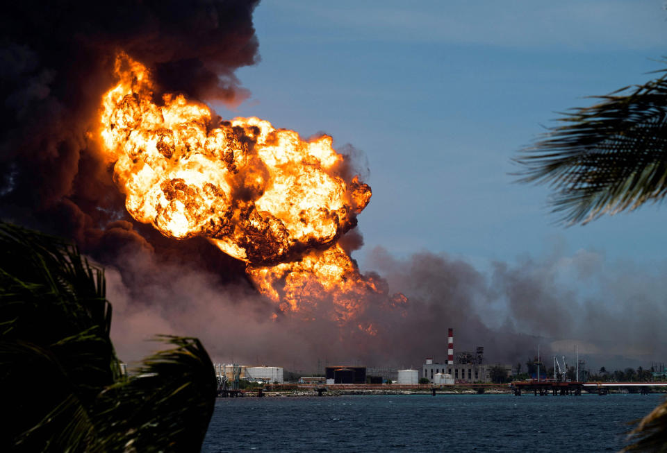 Flames rise from a massive fire at a fuel depot sparked by a lightning strike in Matanzas, Cuba, on Aug. 8, 2022. (Yamil Lage / AFP - Getty Images)