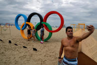 <p>A man takes a selfie in front of the Olympic Rings, displayed at the Copacabana beach ahead of the 2016 Rio Olympic games in Rio de Janeiro, Brazil July 22, 2016. (Stoyan Nenov/Reuters)</p>