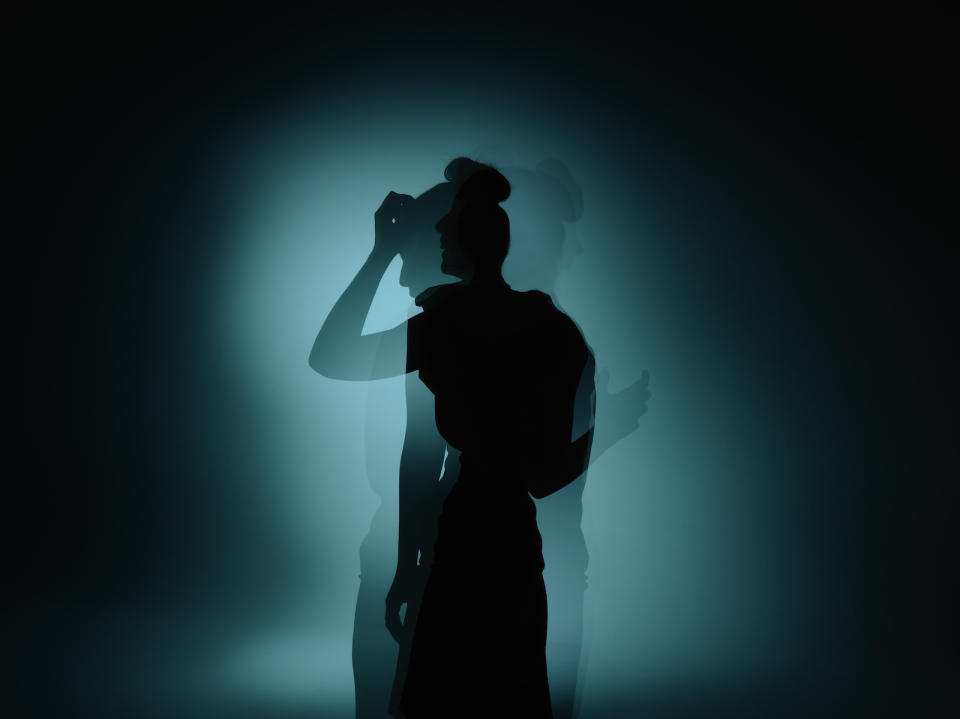 Silhouette shot of a woman to show distress.