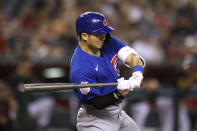 Chicago Cubs Seiya Suzuki swings as he hits a single during the ninth inning of the team's baseball game against the Arizona Diamondbacks on Saturday, May 14, 2022, in Phoenix. (AP Photo/Chris Coduto)