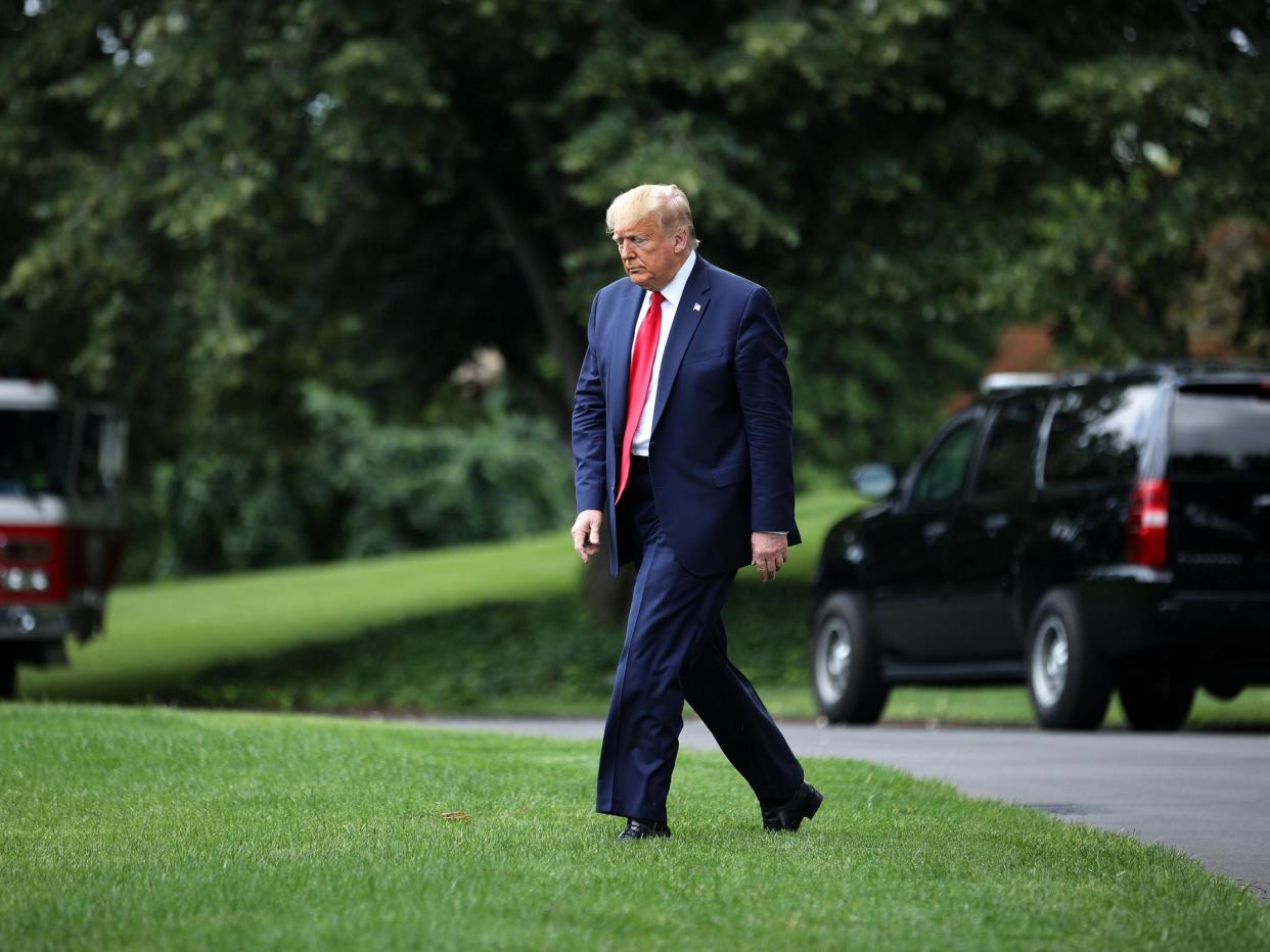President Donald Trump walks across the South Lawn before boarding Marine One and departing the White House: (2020 Getty Images)