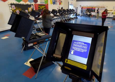 FILE PHOTO: Voting machines are set up for people to cast their ballots during voting in the 2016 presidential election at Manuel J. Cortez Elementary School in Las Vegas, Nevada, U.S, November 8, 2016. REUTERS/David Becker/File Photo