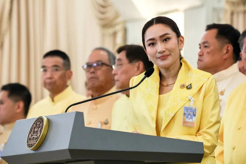 Thailand's Prime Minister Paetongtarn Shinawatra and her cabinet members attend a press conference in Bangkok