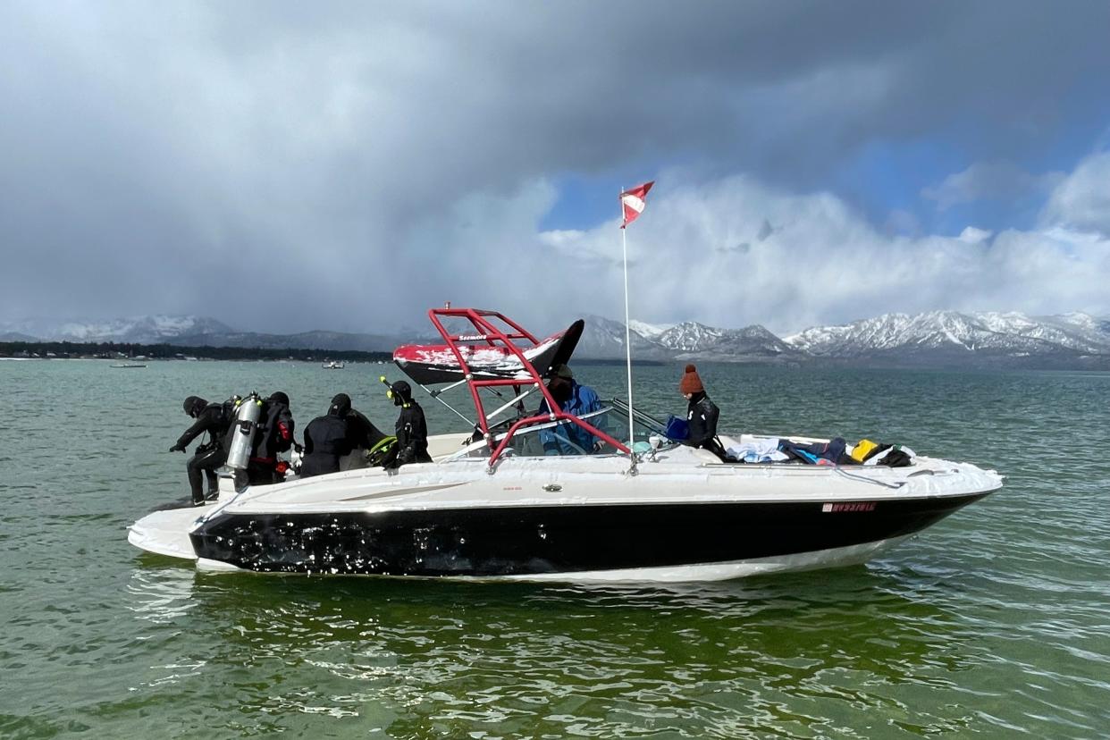 Divers prepare to enter the water at the end of the year-long Lake Tahoe cleanup in Stateline, Nev., May 10, 2022. Nonprofit Clean Up The Lake found no trace of a mythical sea monster, mobsters in concrete shoes or long-lost treasure chests. But scuba divers who spent the past year cleaning up Lake Tahoe's entire 72-mile shoreline have come away with what they hope will prove much more valuable: tons and tons of trash.