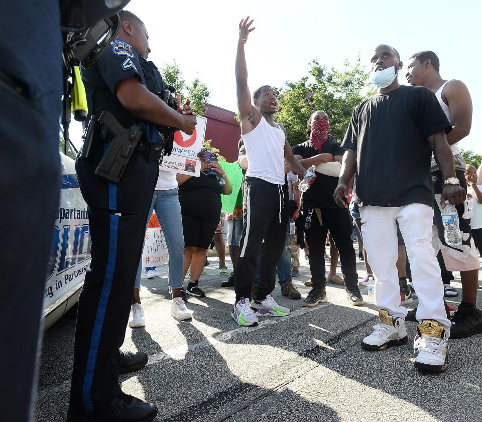 A group of peaceful protesters marched around the Spartanburg downtown area and to Barnet Park on Sunday.