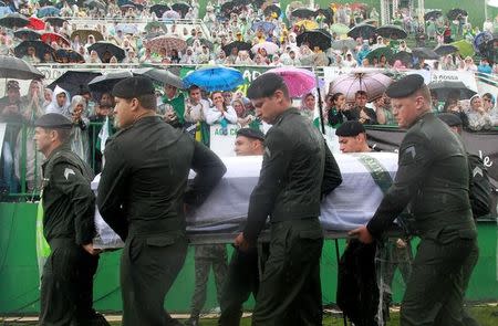 The coffin of one of the victims of the plane crash in Colombia arrives at the Arena Conda stadium in Chapeco, Brazil, December 3, 2016. REUTERS/Diego Vara