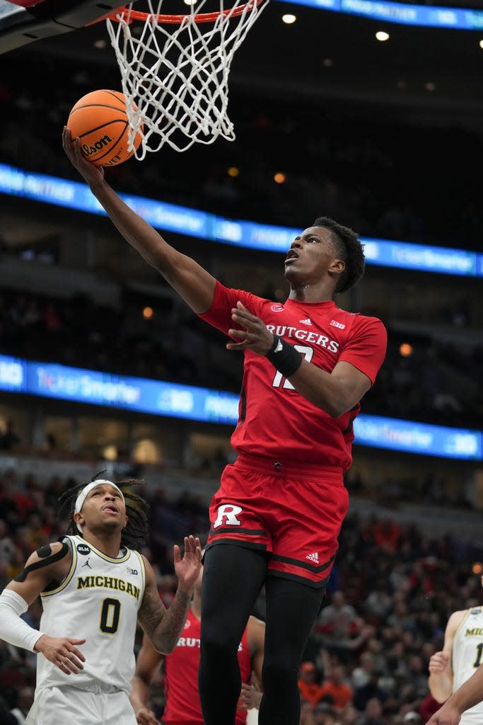 Rutgers' Antwone Woolfolk (13) goes up for a basket during the first half of an NCAA college basketball game against Michigan at the Big Ten men's tournament, Thursday, March 9, 2023, in Chicago. (AP Photo/Erin Hooley)