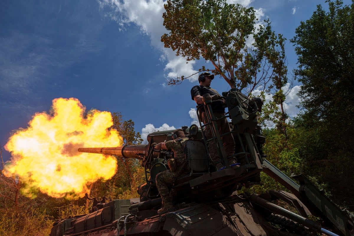 Ukrainian soldiers, of 43rd artillery brigade, fire a self-propelled howitzer towards Russian positions at the frontline in Donetsk province (AP)