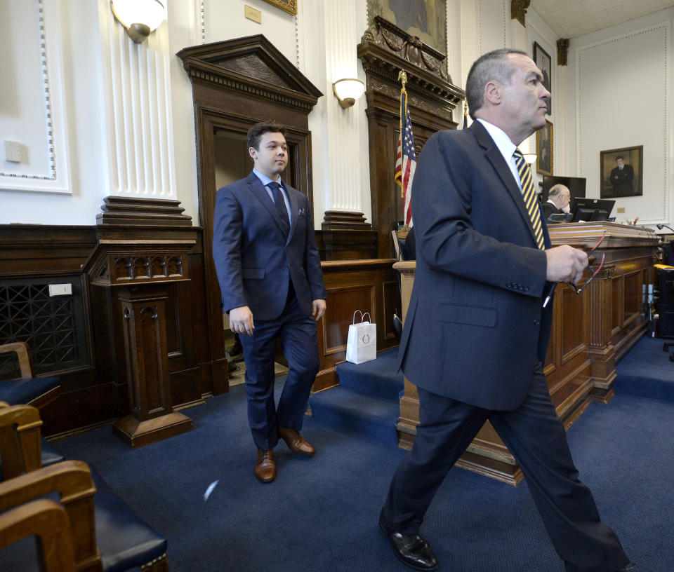 Kyle Rittenhouse, left, walks into the courtroom with attorney Mark Richards for a motion hearing in Kenosha, Wis., on Friday, Sept. 17, 2021. (Sean Krajacic/The Kenosha News via AP)