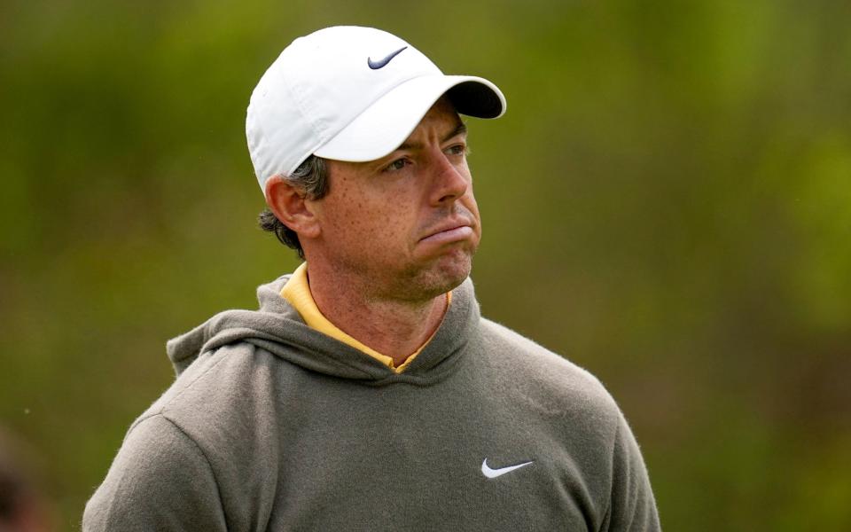 Rory McIlroy, of Northern Ireland, watches his tee shot on the fourth hole during a practice around for the PGA Championship golf tournament at Oak Hill Country Club - AP Photo/Abbie Parr