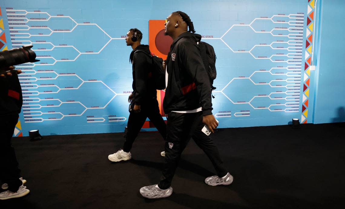 N.C. State’s Ernest Ross, left, and DJ Burns Jr. head to the locker room before the Wolfpack’s game against Purdue in the NCAA Tournament national semfinals at State Farm Stadium in Glendale, Ariz., Saturday, April 6, 2024. Ethan Hyman/ehyman@newsobserver.com