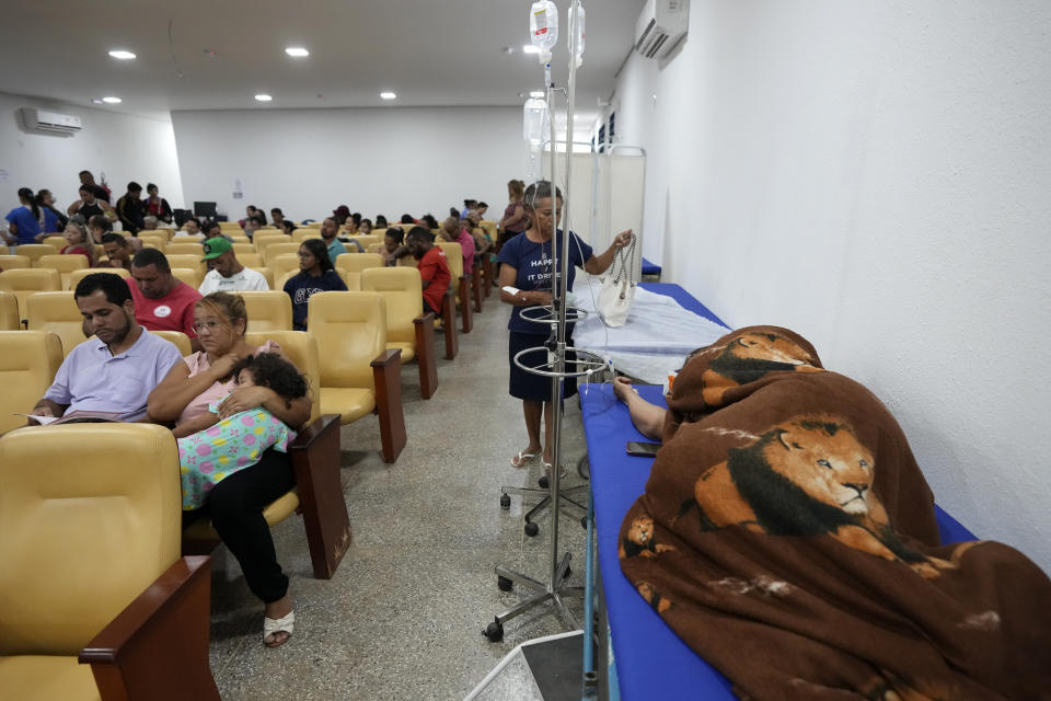 Dengue patients wait to receive treatment in a provisional clinic in the Santa Maria neighborhood of Brasilia, Brazil, Tuesday, Jan. 23, 2024. (AP Photo/Eraldo Peres)