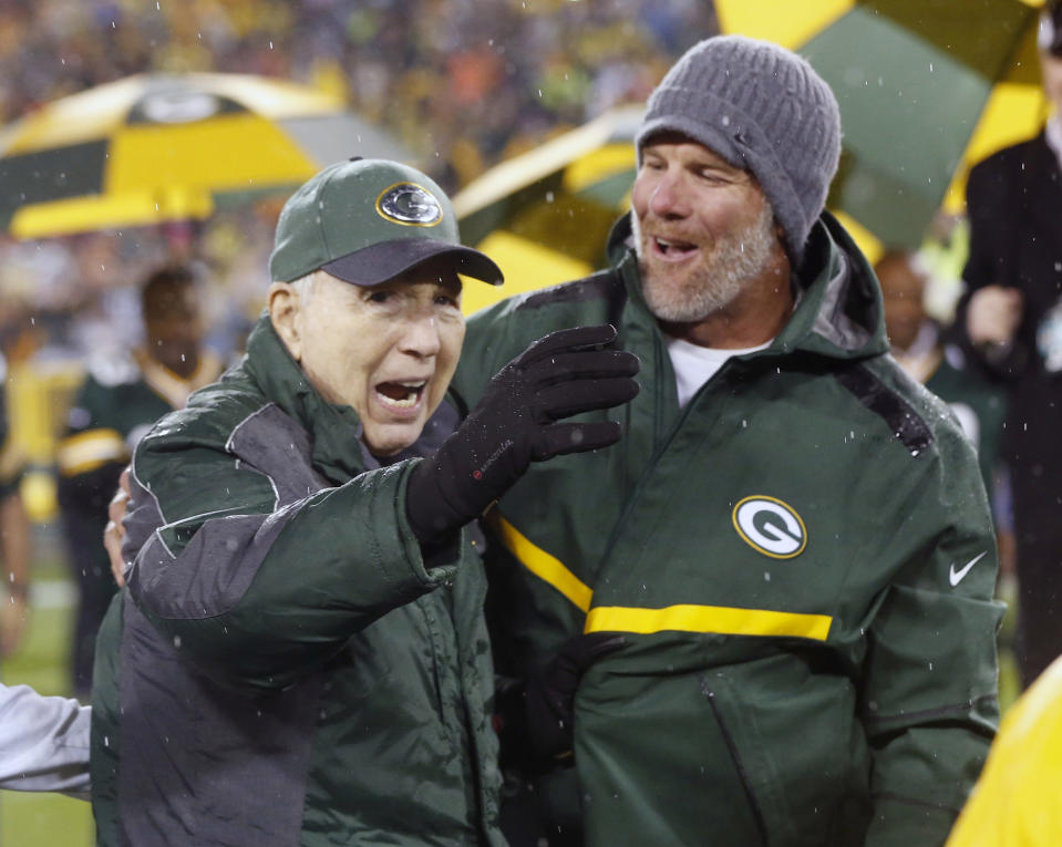 FILE - In this Thursday, Nov. 26, 2015, file photo, Brett Favre, right, smiles at Bart Starr during a ceremony at halftime of an NFL football game between the Green Bay Packers and Chicago Bears in Green Bay, Wis. Starr, the Green Bay Packers quarterback and catalyst of Vince Lombardi's powerhouse teams of the 1960s, has died. He was 85. The Packers announced Sunday, May 26, 2019, that Starr had died, citing his family. He had been in failing health since suffering a serious stroke in 2014. (AP Photo/Mike Roemer, File)