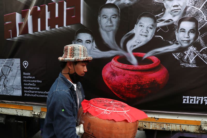 Pro-democracy protesters perform a ritual to capture the spirits of the Royal Thai Army leaders at the Royal Thai Army Headquarters in Bangkok