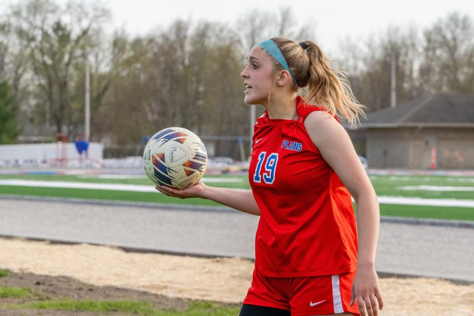 Pleasant Plains forward Ella Wilcockson readies to throw the ball during a nonconference girls soccer match against Sacred Heart-Griffin on Monday, April 10, 2023.