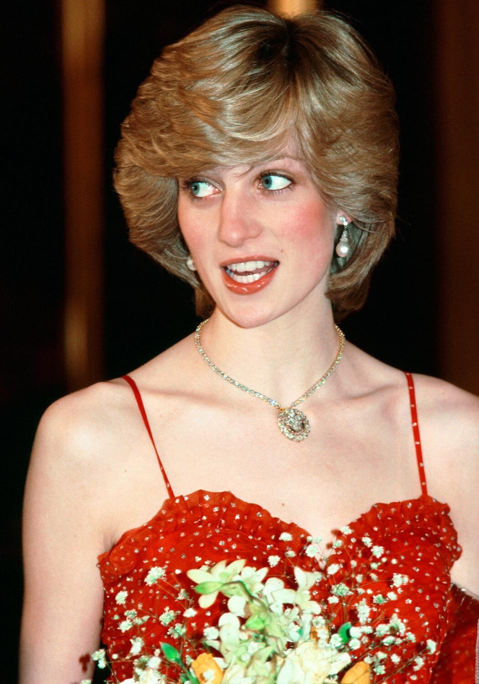 Princess Diana Wearing A Gold And Diamond Necklace In The Shape Of The Prince Of Wales Feathers For A Visit To The Royal Opera House