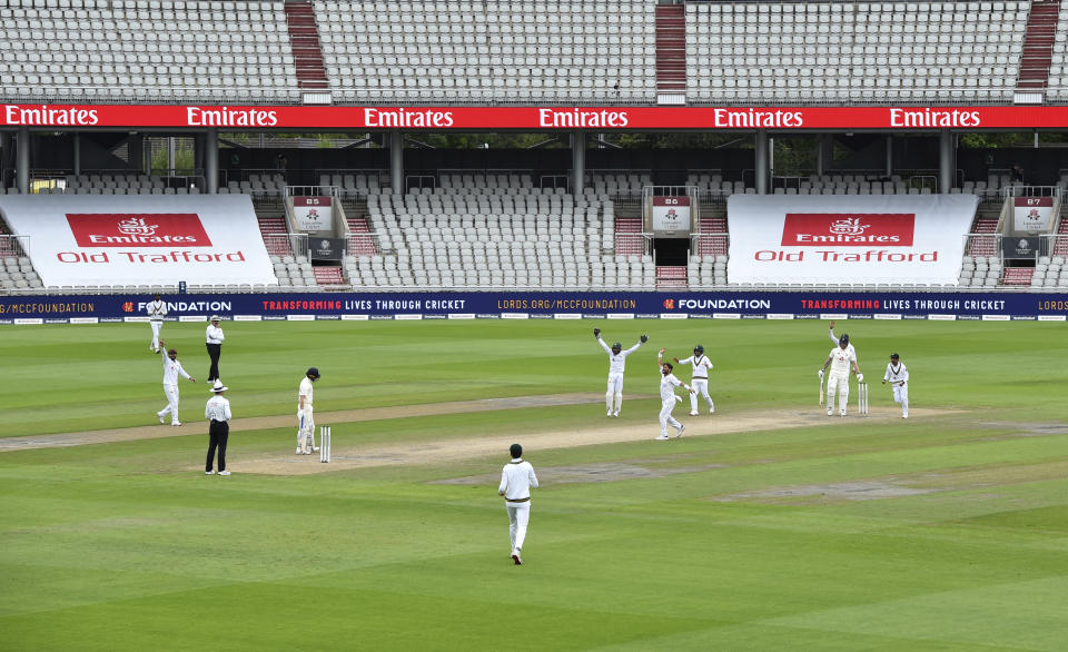 Pakistan players celebrate the dismissal of England's Ben Stokes, second right, during the fourth day of the first cricket Test match between England and Pakistan at Old Trafford in Manchester, England, Saturday, Aug. 8, 2020. (Dan Mullan/Pool via AP)