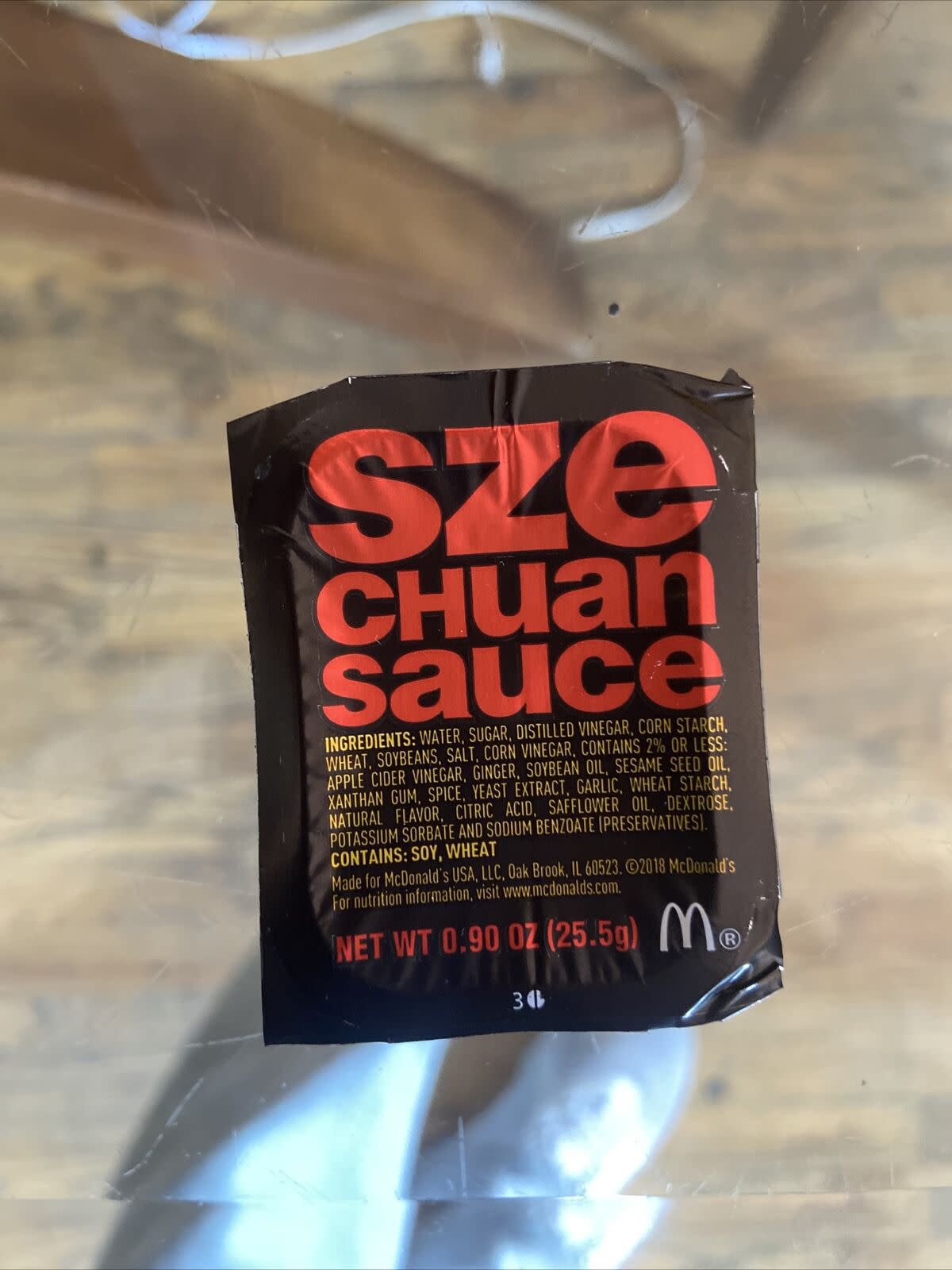 Closeup of container of McDonalds Szechuan Sauce