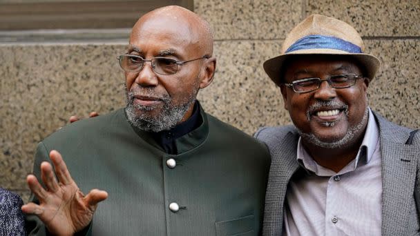 PHOTO: Muhammad Aziz stands outside Manhattan court with journalist Abdur-Rahmman Muhammad, after Aziz's conviction in the killing of Malcolm X was vacated, Nov. 18, 2021, in New York.   (Seth Wenig/AP, FILE)