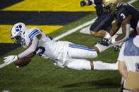 BYU running back Tyler Allgeier dives for a touchdown as Navy defensive back Cameron Kinley (3) defends during the second half of an NCAA college football game, Monday, Sept. 7, 2020, in Annapolis, Md. (AP Photo/Tommy Gilligan)