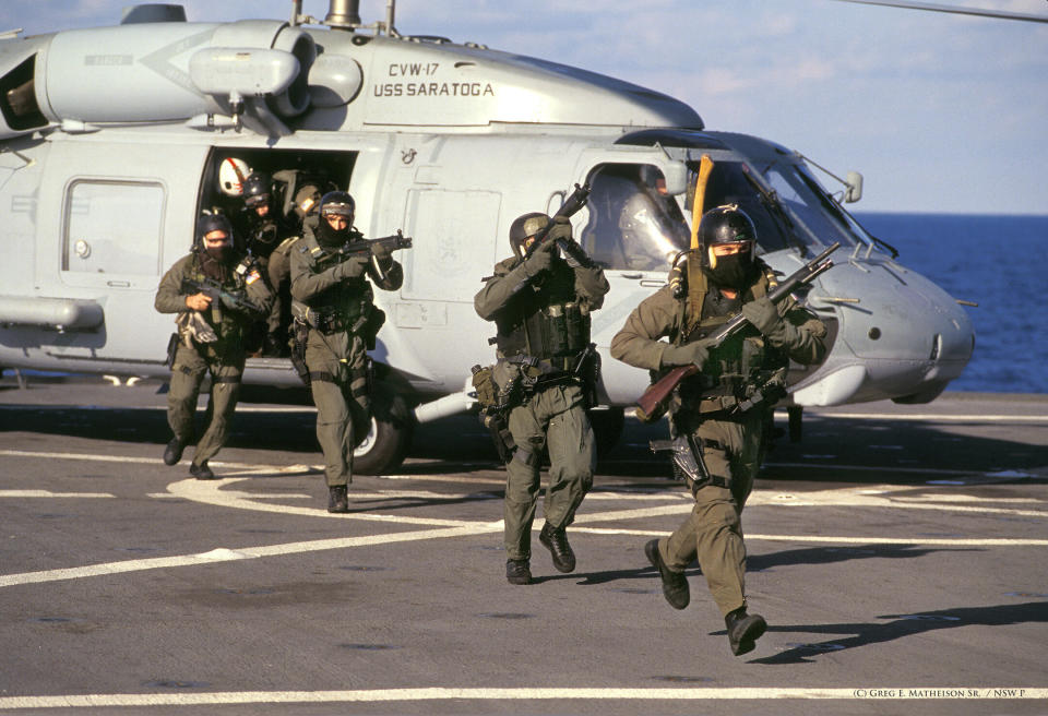 SEALs  board a ship during a training exercise aboard the USS Mount Whitney in the early 90's.  VBSS known for – Visit, Board, Search and Seizure, is one of a number of way of dealing with piracy and ships transporting illegal arms.  Photo: (C) 2011 Greg E. Mathieson Sr.  / NSW Publications, LLC