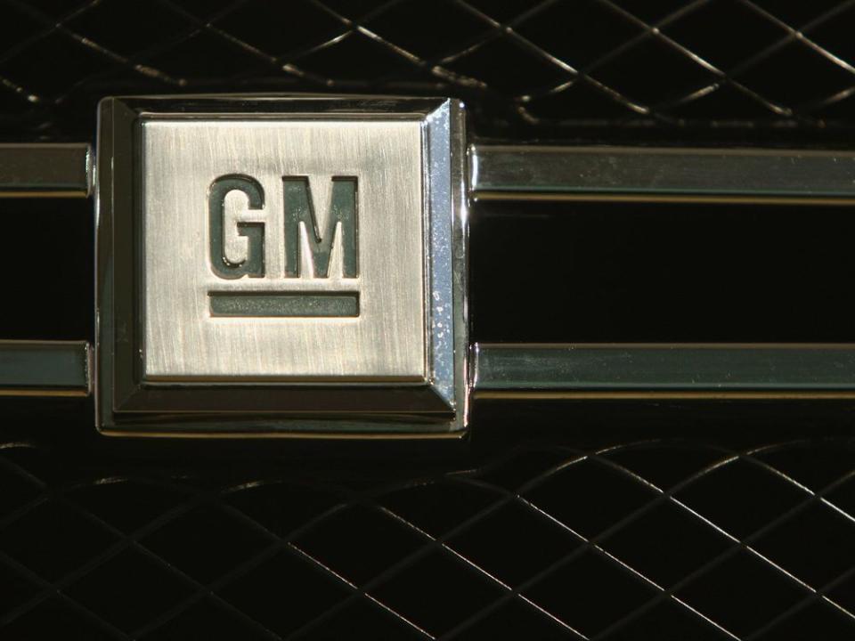  The logo of U.S. carmaker General Motors is visible on the front grille of a new vehicle.