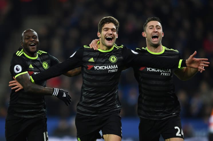 LEICESTER, ENGLAND - JANUARY 14: Marcos Alonso (C) of Chelsea celebrates with teammates Victor Moses (L) and Gary Cahill (R) after scoring his team's second goal during the Premier League match between Leicester City and Chelsea at The King Power Stadium on January 14, 2017 in Leicester, England. (Photo by Laurence Griffiths/Getty Images)