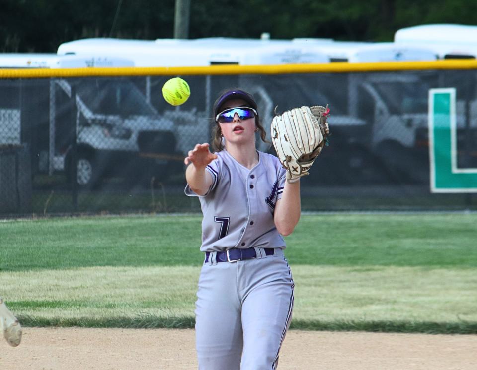 Lexington-Ridgeview second baseman Eleana Atkins makes a throw to first for an out.