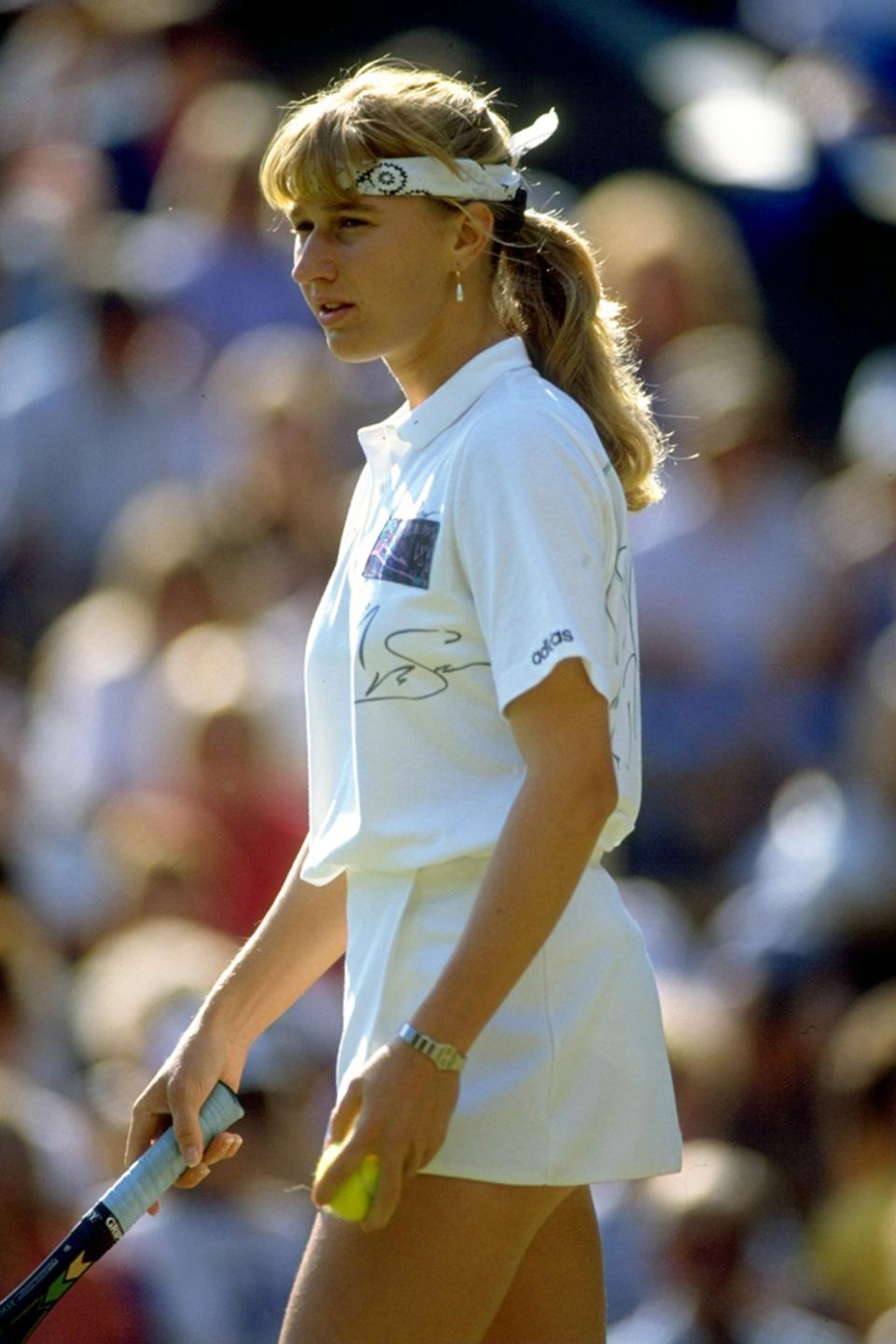 Jun-Jul 1990: Steffi Graf of West Germany prepares to serve during the Lawn Tennis Championships at Wimbledon in London. Mandatory Credit: Bob Martin/Allsport