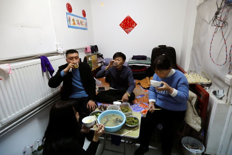 The Wider Image: 'I've let them down': Beijing's migrant workers miss family reunions on Lunar New Year