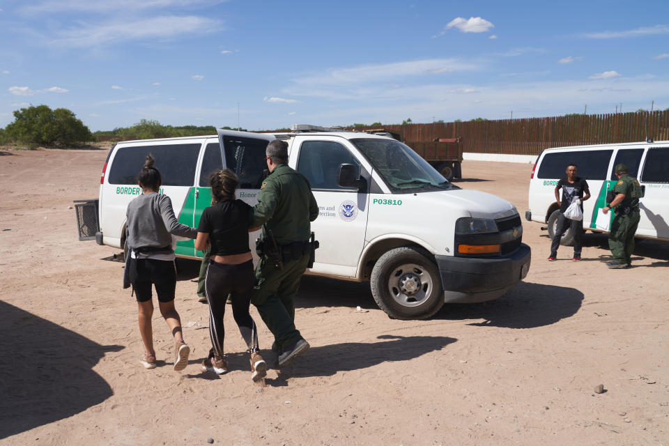 Migrants are transported after waiting in high heat to be processed by U.S. Border Patrol after illegally crossing into Eagle Pass, Texas, from Mexico on July 26, 2022. / Credit: Allison Dinner/Anadolu Agency via Getty Images