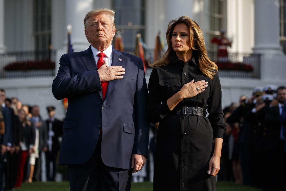 President Donald Trump and first lady Melania Trump participate in a moment of silence honoring the victims of the Sept. 11 terrorist attacks, on the South Lawn of the White House, Wednesday, Sept. 11, 2019, in Washington. (AP Photo/Evan Vucci)