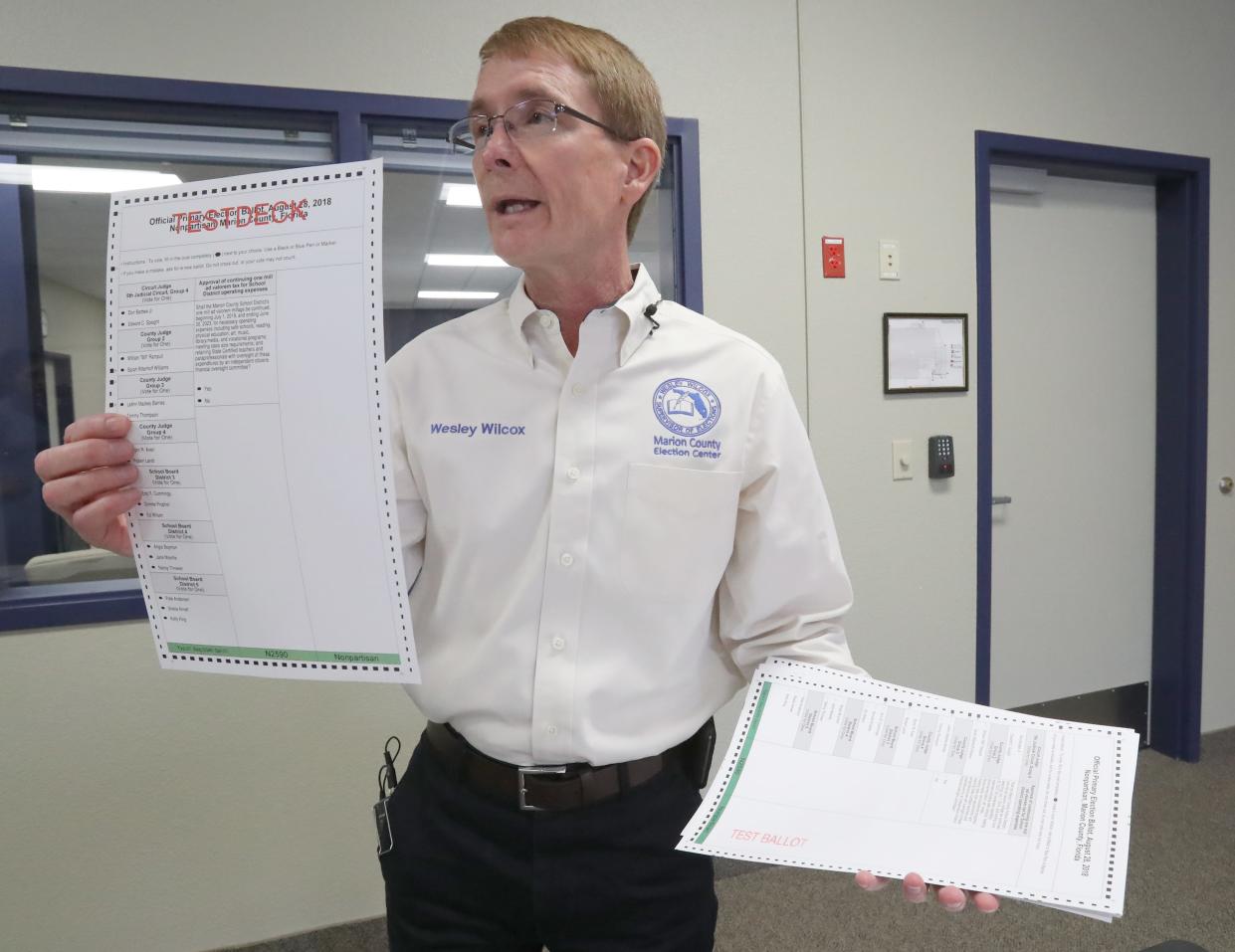 Wesley Wilcox, the Supervisor of Elections for Marion County, displays “Testdeck” sample ballots as elections technicians test ballot machines during Logic and Accuracy testing for the upcoming Primary at the Marion County Election Center on Northeast 16th Street in Ocala, Fla. in this 2018 file photo.