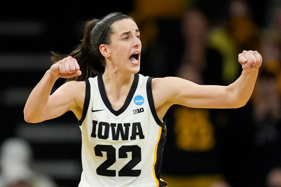 FILE – Iowa guard Caitlin Clark reacts during a second-round college basketball game against <a class="link " href="https://sports.yahoo.com/ncaaw/teams/west-virginia/" data-i13n="sec:content-canvas;subsec:anchor_text;elm:context_link" data-ylk="slk:West Virginia;sec:content-canvas;subsec:anchor_text;elm:context_link;itc:0">West Virginia</a> in the NCAA Tournament, Monday, March 25, 2024, in Iowa City, Iowa. As Clark has become the face of women’s basketball, her face is everywhere. She has lucrative NIL deals with Nike, Gatorade, Buick and was featured in a State Farm commercial with Jimmy Butler and Reggie Miller. (AP Photo/Charlie Neibergall, File)