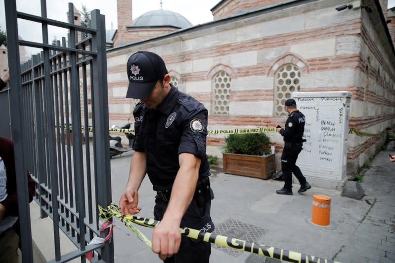 Turkish police officers stand outisde the home office of James Le Mesurier, founder of the Mayday Rescue group, in Istanbul