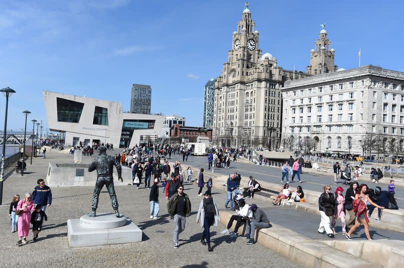 People enjoying  glorious weather on the waterfront