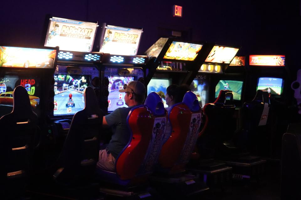 People play Mario Kart at Wayback's Arcade in Pineville in late October. The arcade has retro cabinet games, pinball machines, Japanese imports and more.