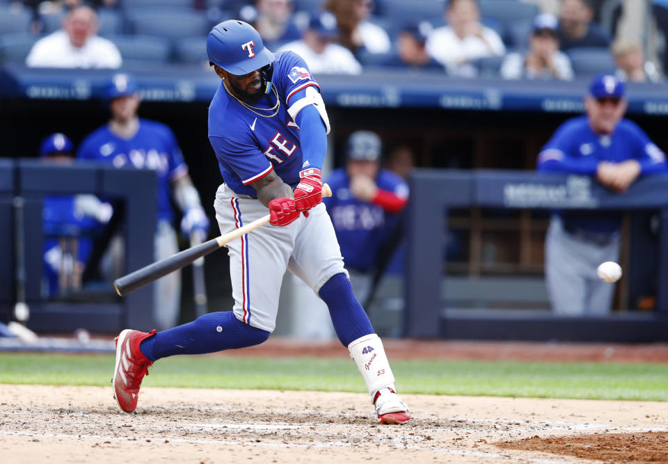 Texas Rangers right fielder Adolis Garcia (53) hits a single against the New York Yankees during the sixth inning of a baseball game, Saturday, June 24, 2023, in New York. (AP Photo/Noah K. Murray)